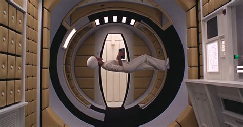 Astronaut floating in weightlessness aboard a rotating space station, from 2001: A Space Odyssey